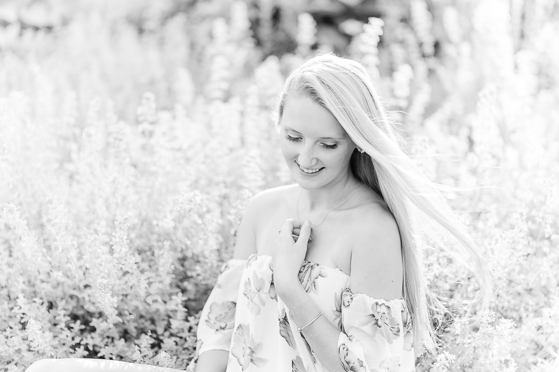 Photo by Cape Cod Senior Portrait Photographer Christina Runnals | High school senior girl sitting in a flower garden in cape Cod