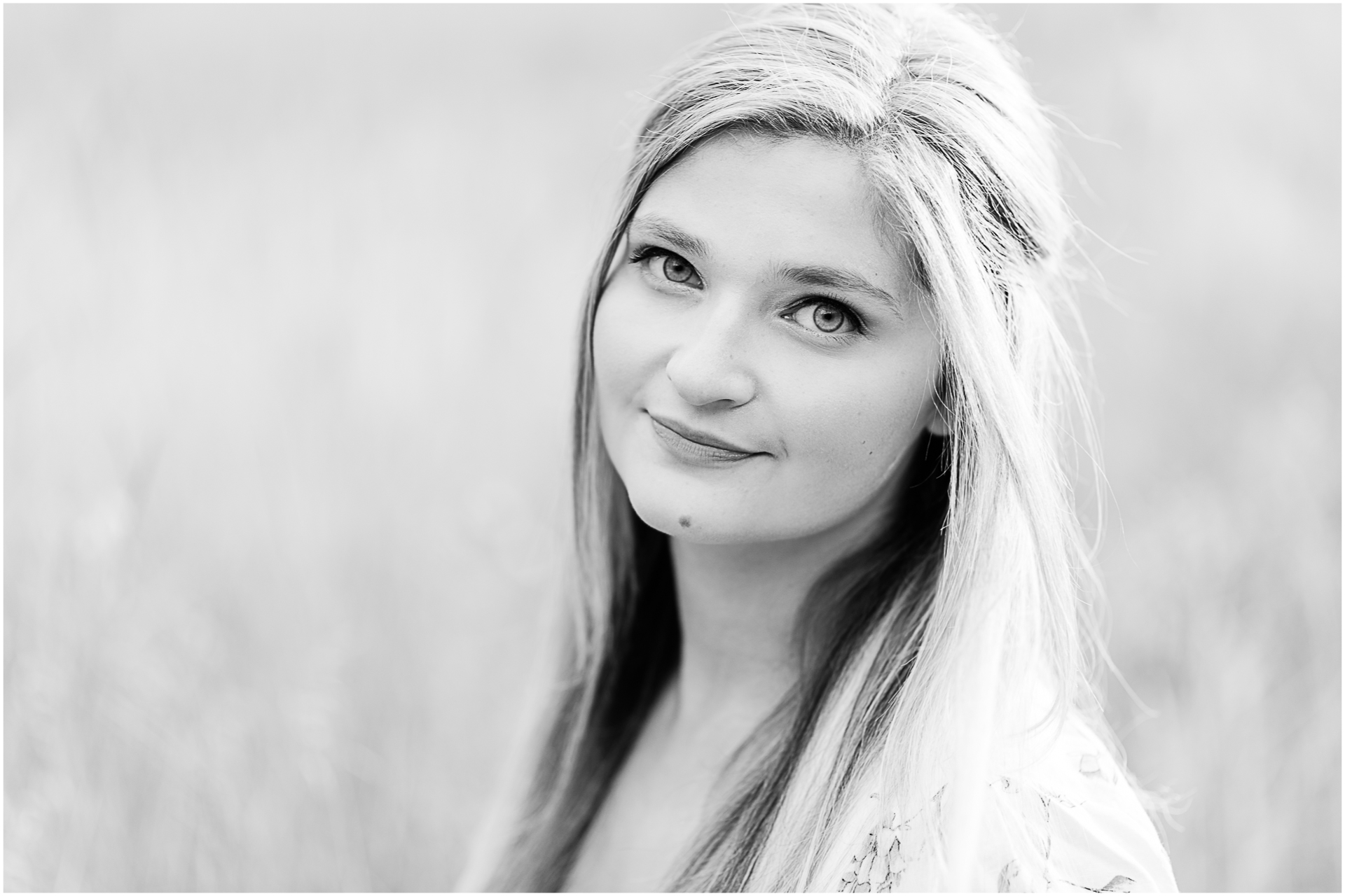 Photo by Marshfield senior portrait photographer Christina Runnals | High school girl sitting in a golden field
