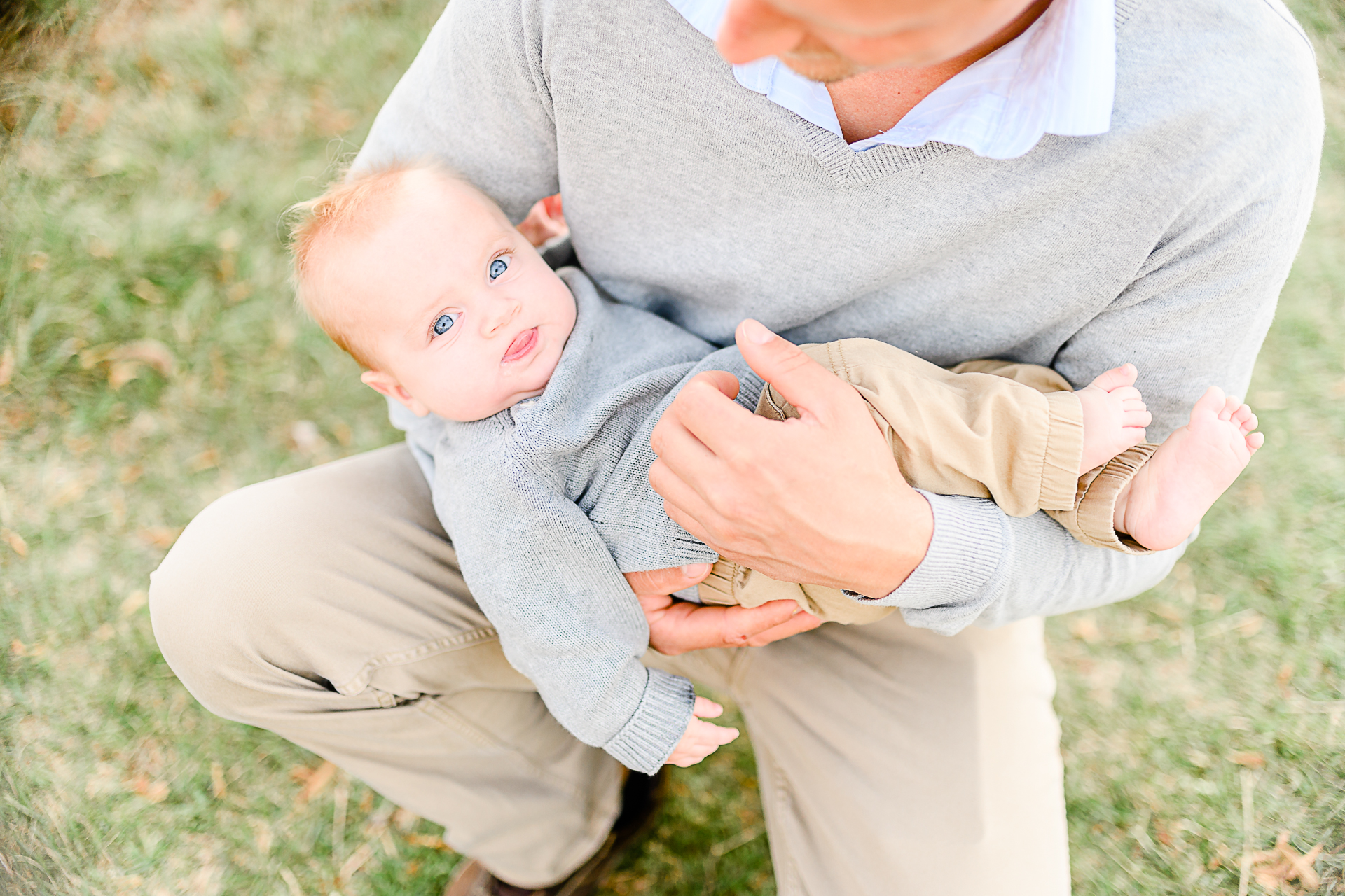 Photo by Norwell Photographer Christina Runnals | Dad holding baby who is making a funny face
