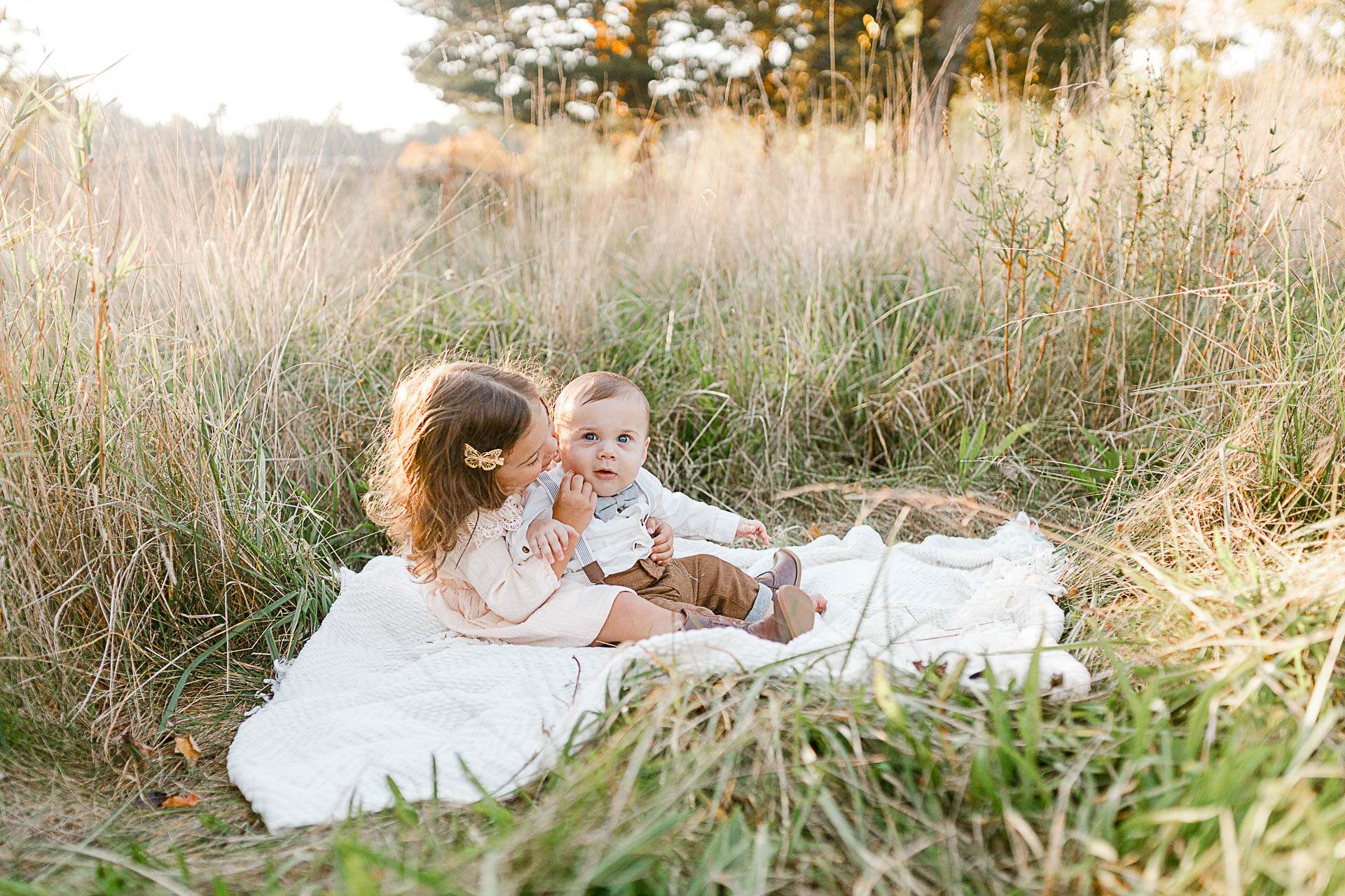 Toddlers on white blanket in field | Norwell Photographer