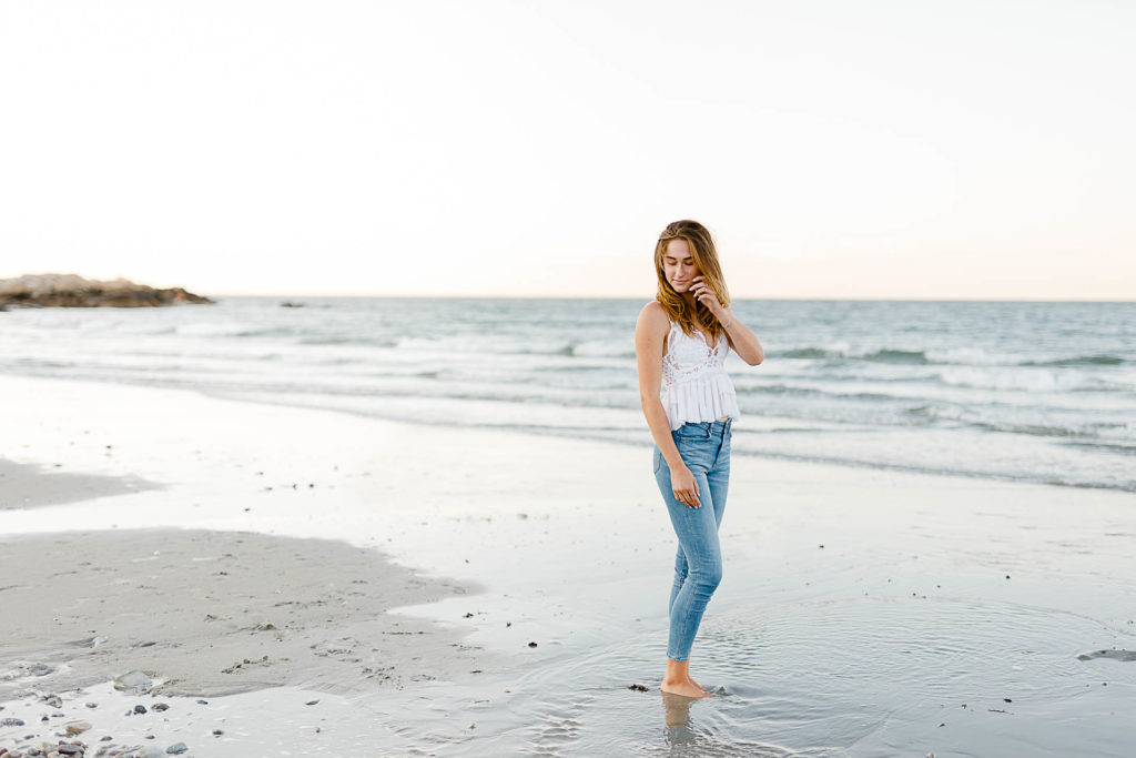 Scituate Senior Pictures by Christina Runnals | A high school senior girl standing in front of the ocean at Sandy Beach in Cohasset