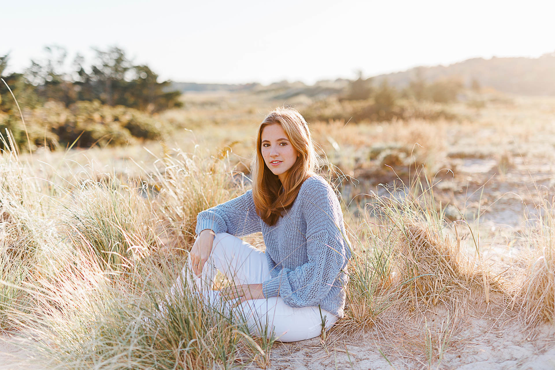 Photo by Cohasset senior photographer Christina Runnals | High school senior girl sitting in beach grass