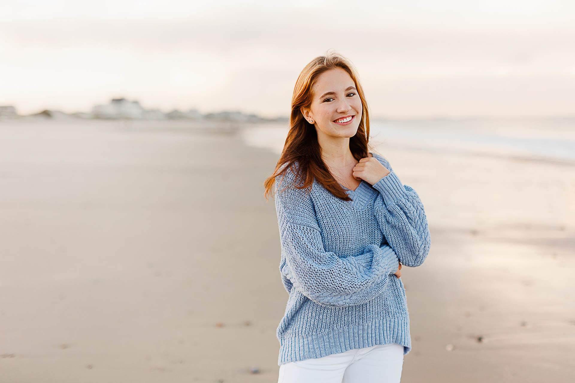 Photo by Cohasset senior photographer Christina Runnals | High school senior girl standing on the beach smiling