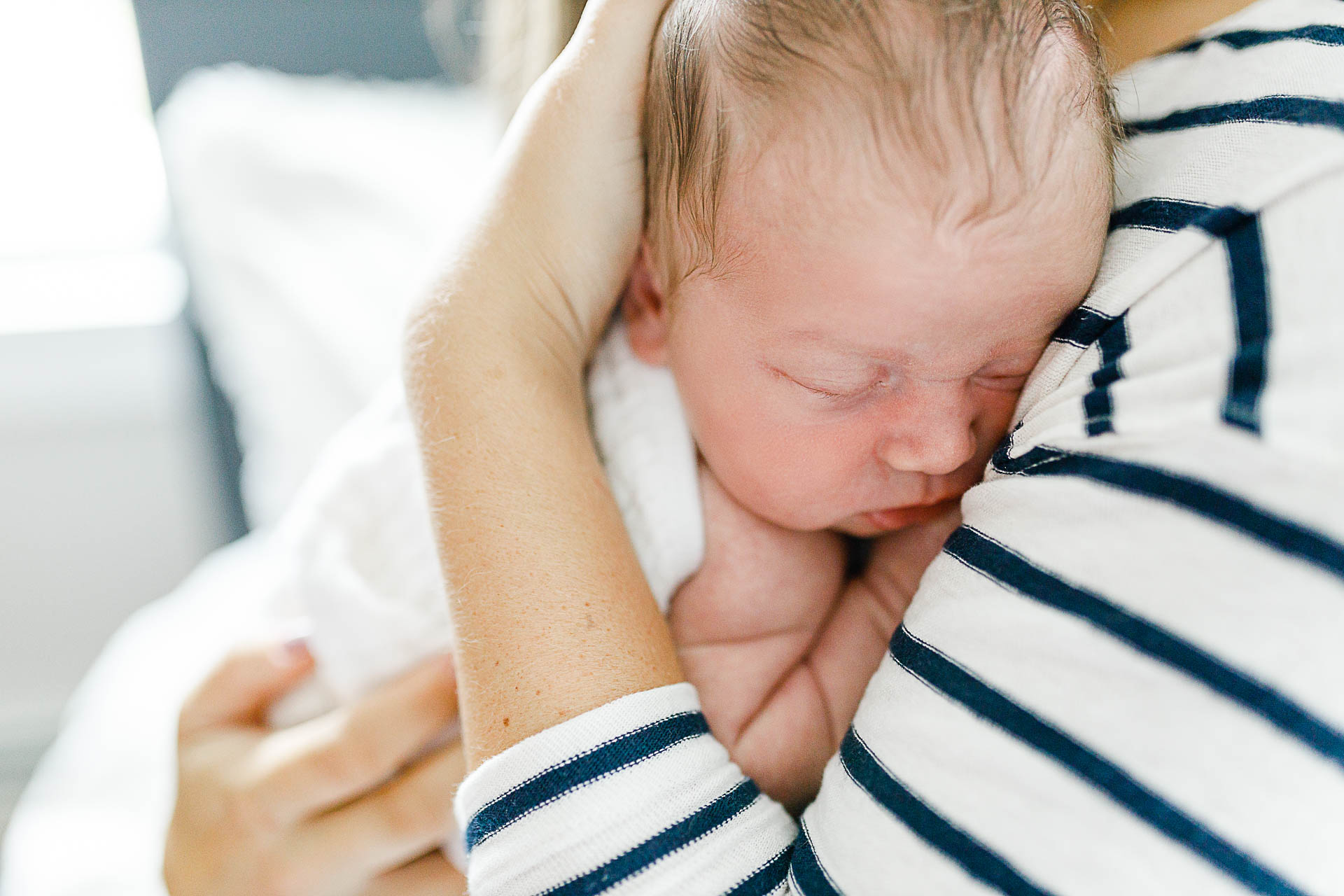 Photo by Scituate newborn photographer Christina Runnals| Mom with newborn up close shot