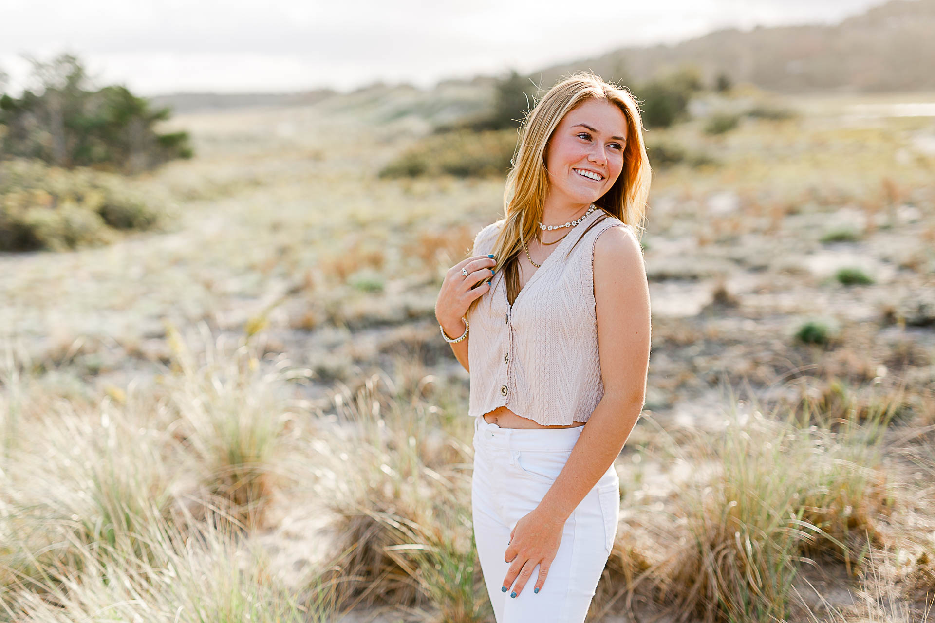 Photo of Caroline's Thayer Academy Senior Pictures by Christina Runnals Photography | Girl smiling in beach grass 
