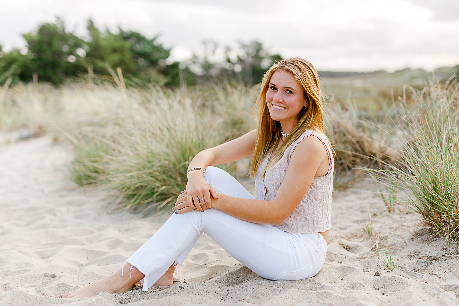 Photo from Caroline's Thayer Academy Senior Pictures by Christina Runnals Photography | High school senior girl sitting in front of beach grass