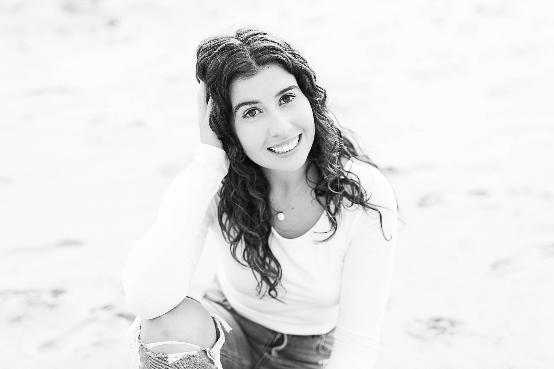 Photo by Hingham Senior Portrait Photographer Christina Runnals | Girl sitting on the beach