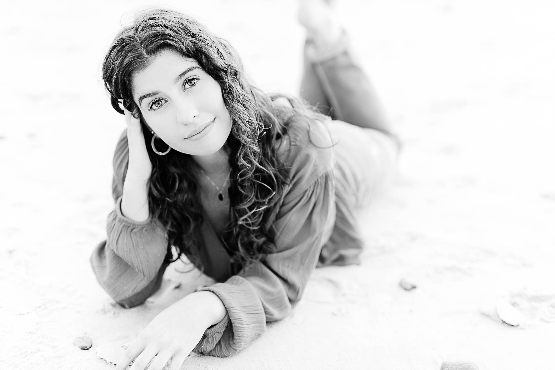 Photo by Hingham Senior Portrait Photographer Christina Runnals | Girl laying on the beach 