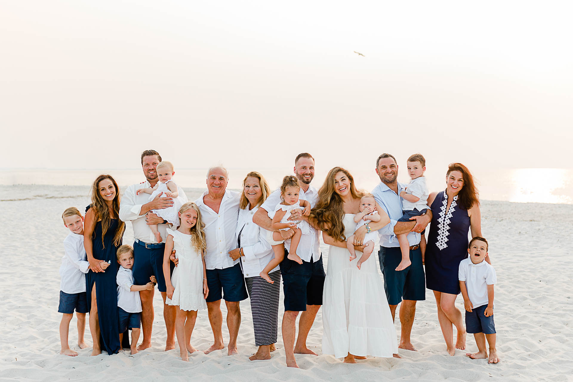 Photo by Cape Cod Family Photographer Christina Runnals | Large extended family on white beach