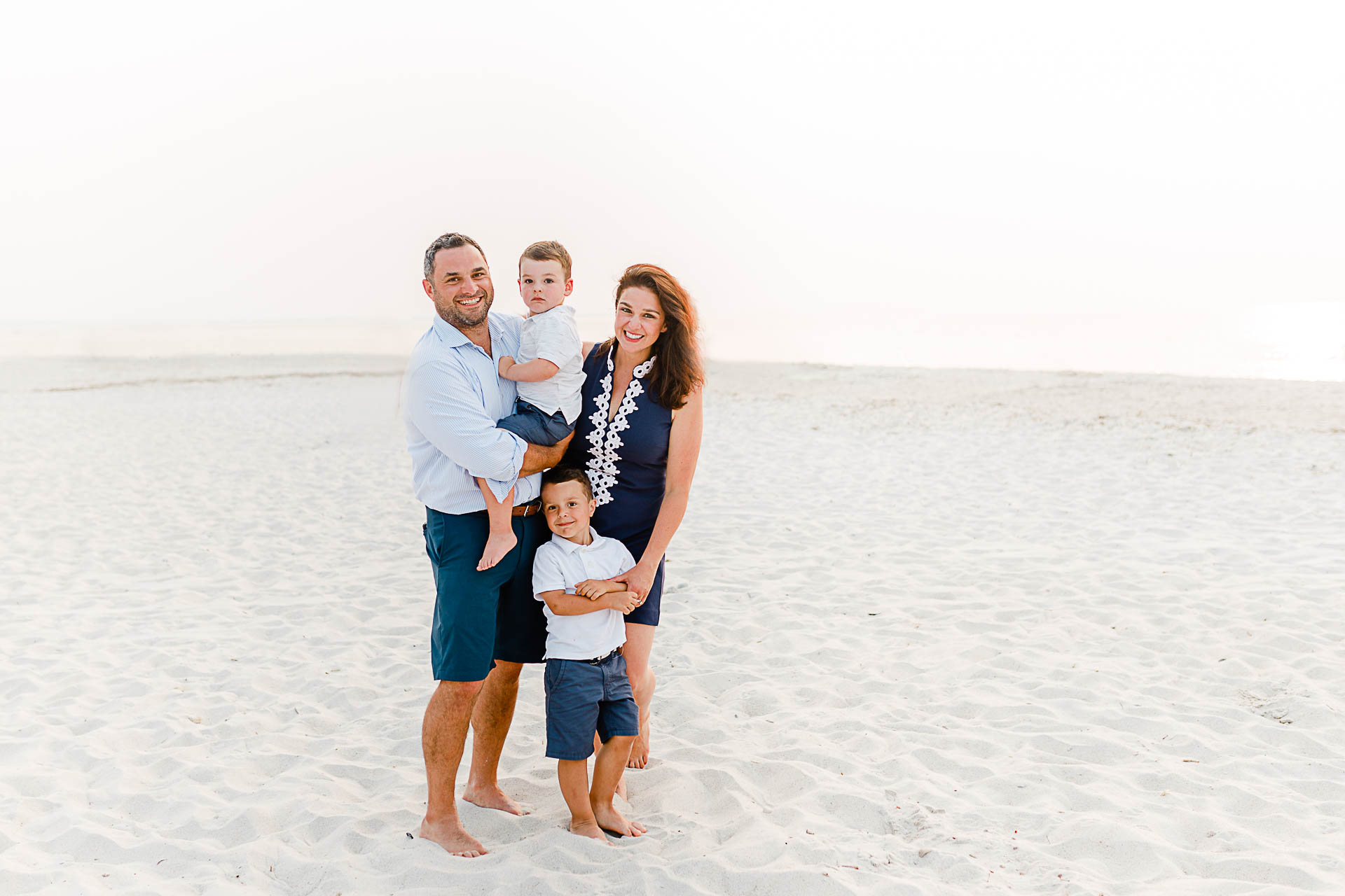 Photo by Cape Cod Family Photographer Christina Runnals | Mom dad and two sons