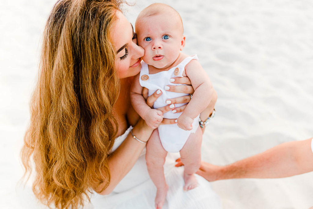 Photo by Cape Cod Family Photographer Christina Runnals | Mom and baby both wearing white on beach