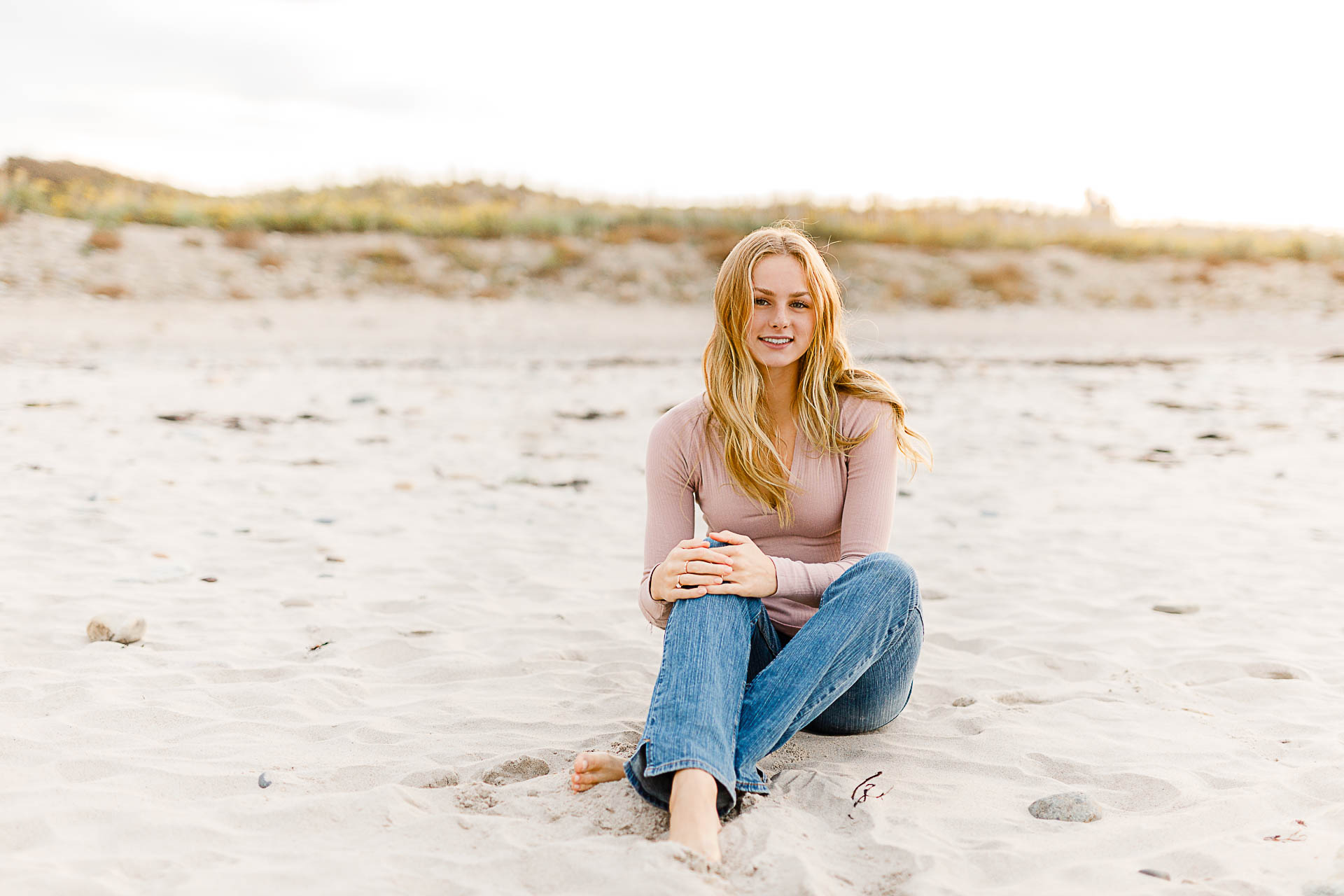 Photo by Scituate Senior Portrait Photographer Christina Runnals | Girl sitting in beach grass wearing a white dress