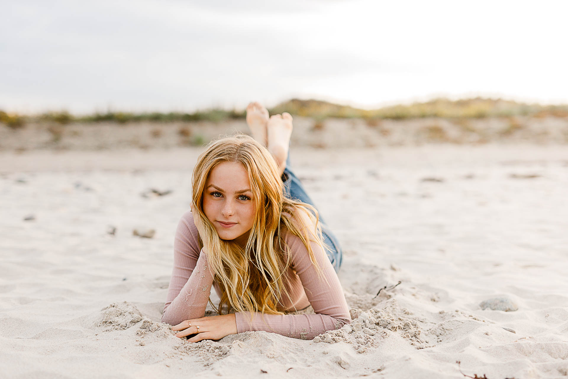 Photo by Plymouth Senior Portrait Photographer Christina Runnals | Girl laying in the sand