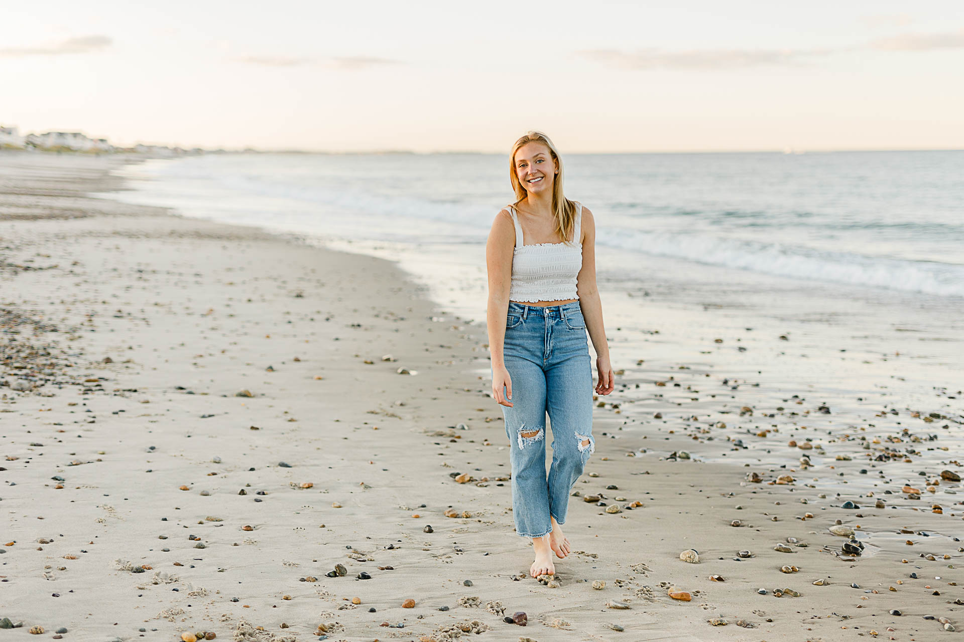 Photo by Christina Runnals Photography who specializes in luxe senior portraits | Girl walking on the beach