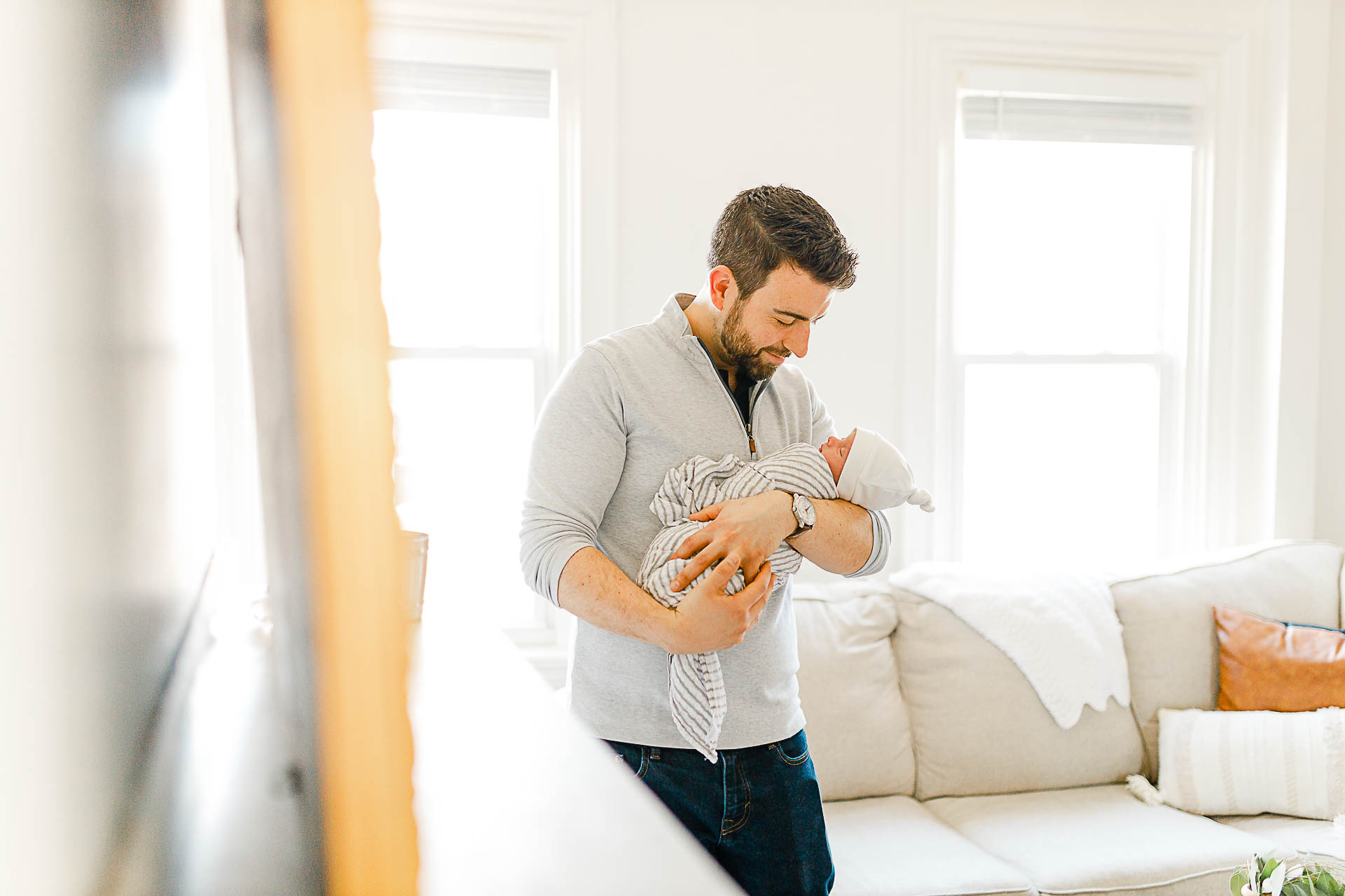Photo by Boston Newborn Photographer Christina Runnals | Father holding his newborn baby boy