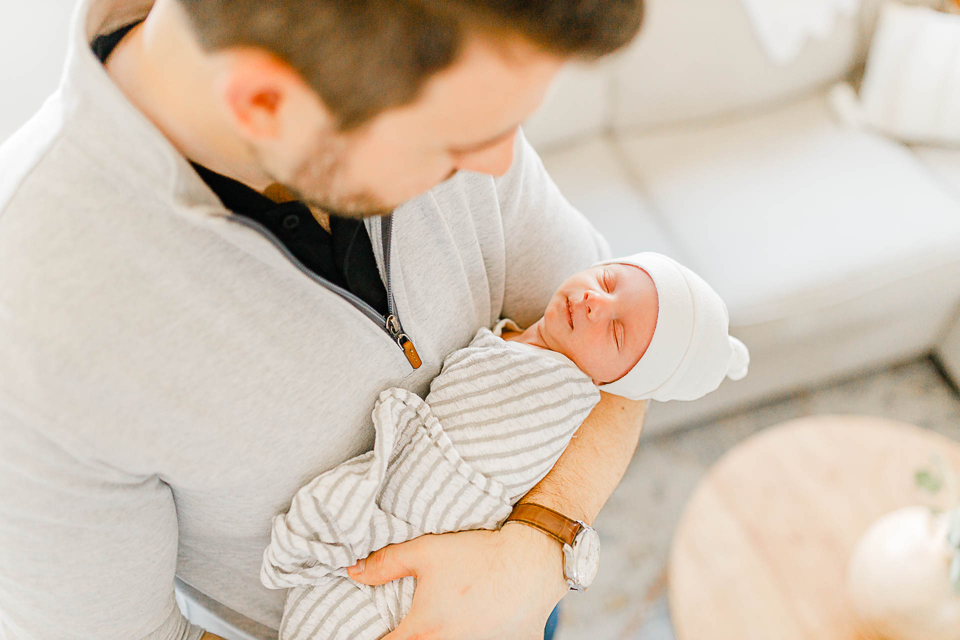 Photo by Boston Newborn Photographer Christina Runnals | Father holding his newborn baby boy