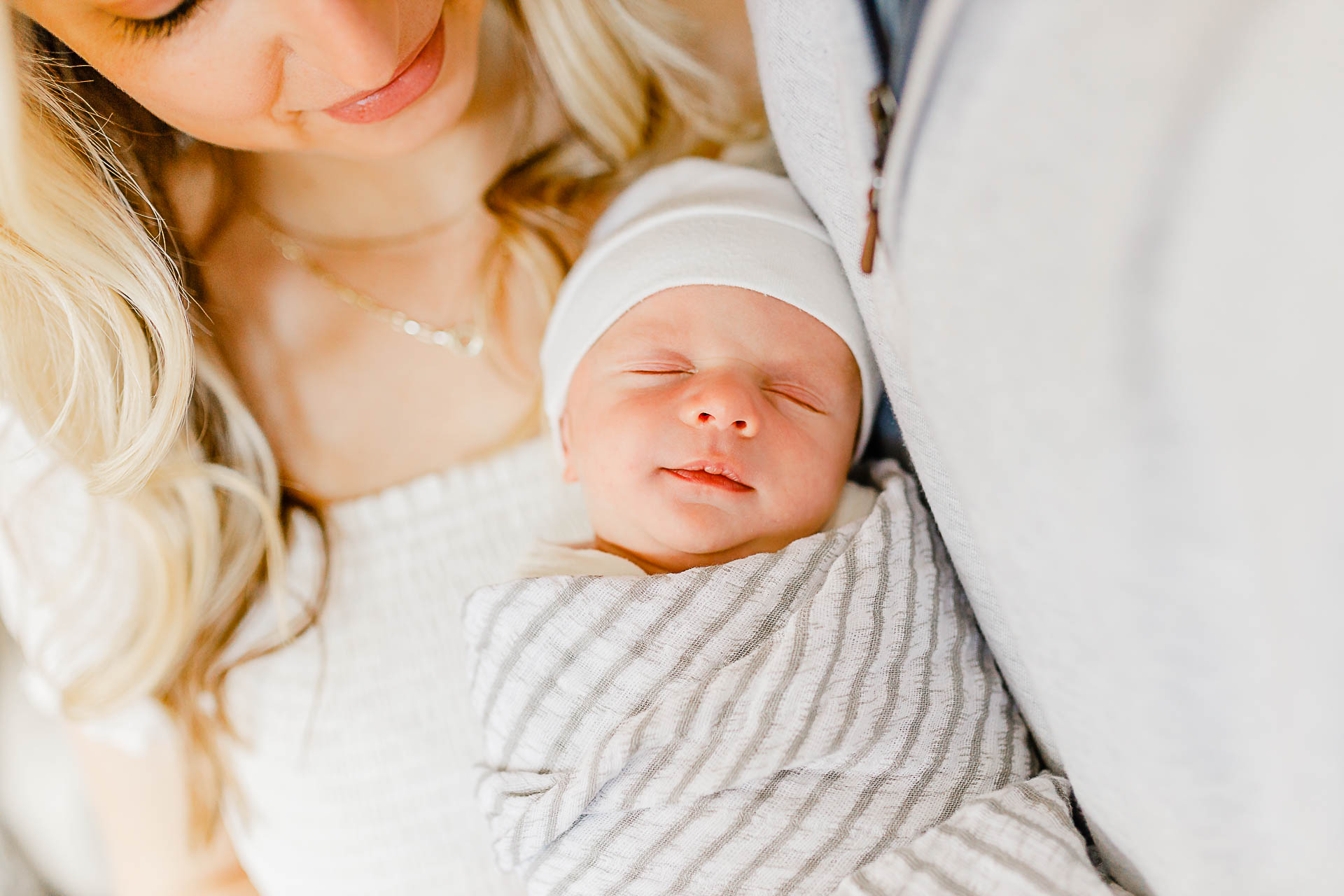 Photo by Boston Newborn Photographer Christina Runnals |  couple holding their newborn baby boy