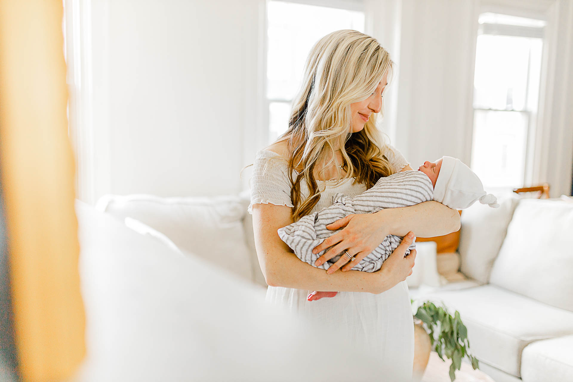 Photo by Boston Newborn Photographer Christina Runnals |  Mother holding her newborn baby boy