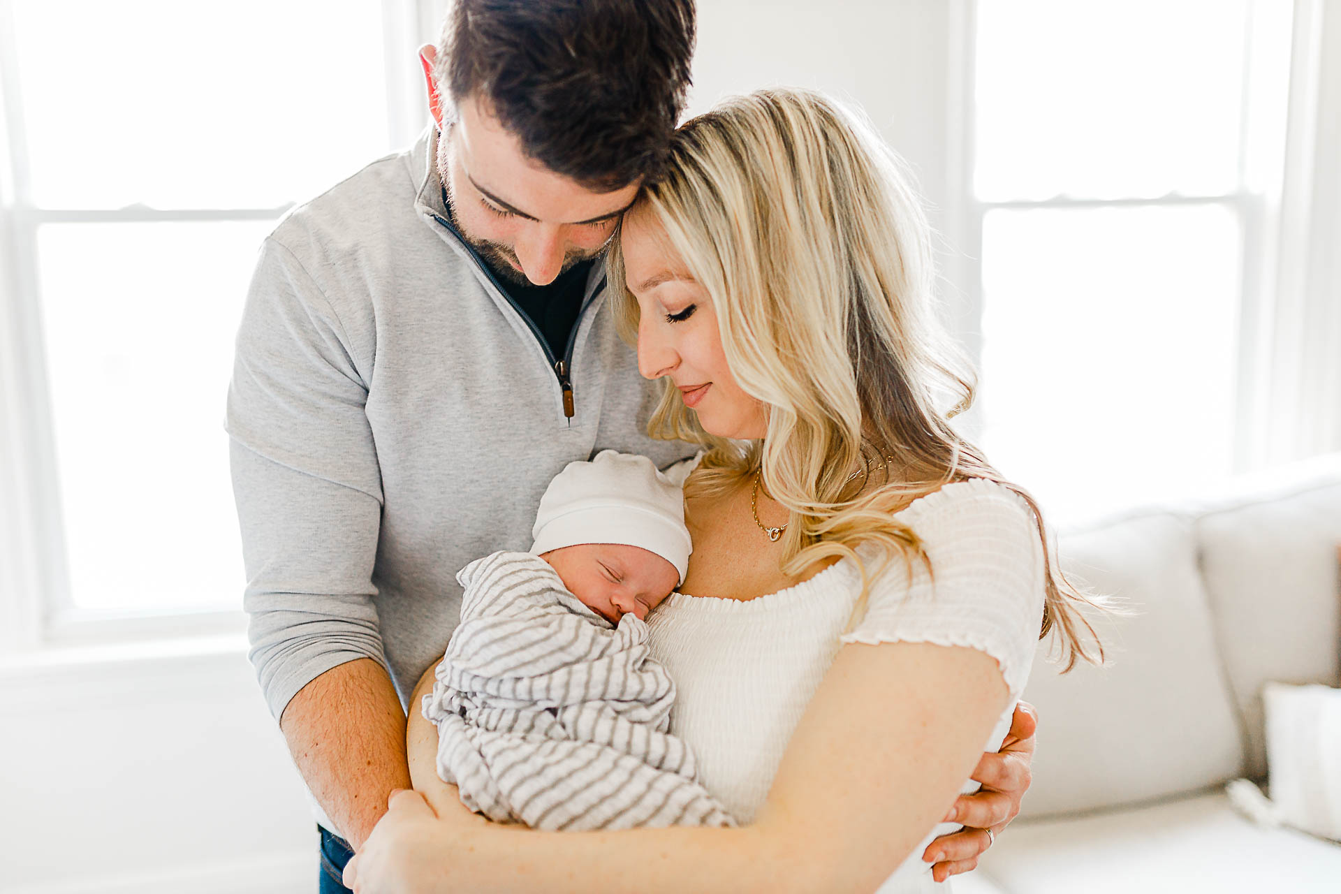 Photo by Boston Newborn Photographer Christina Runnals |  Couple holding their newborn baby boy