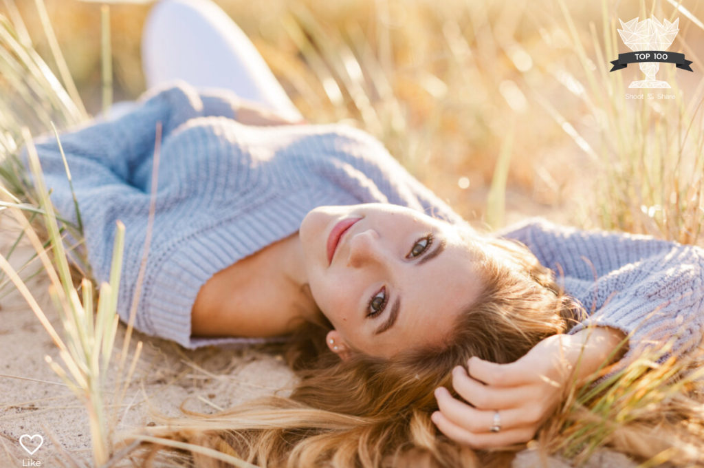 Photo by Boston Senior Portrait Photographer Christina Runnals | Riley, Cohasset High School Class of 2022 | Girl laying in beach grass