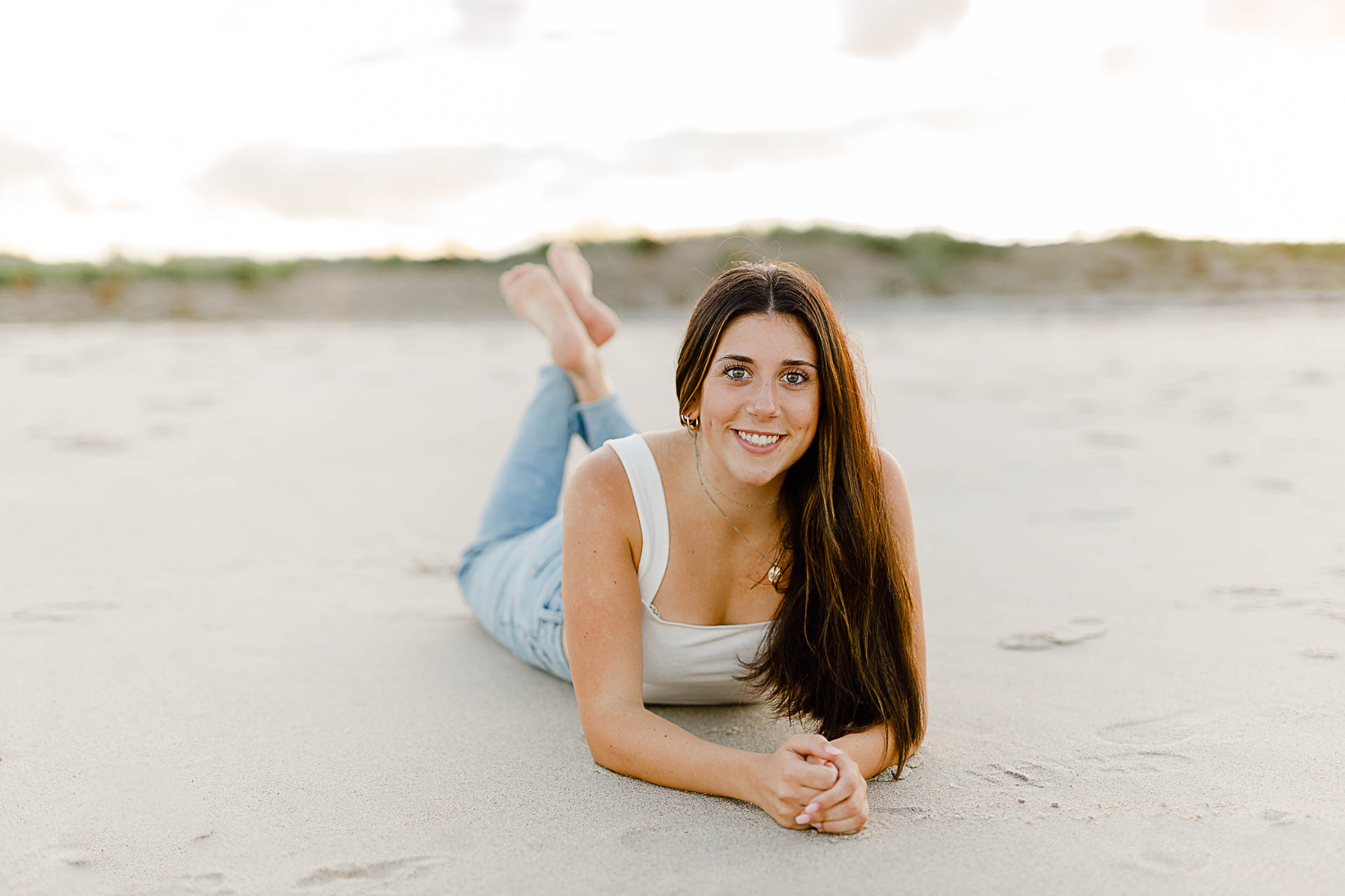 Photo by Norwell Senior Portrait Photographer Christina Runnals | High school girl laying on the beach