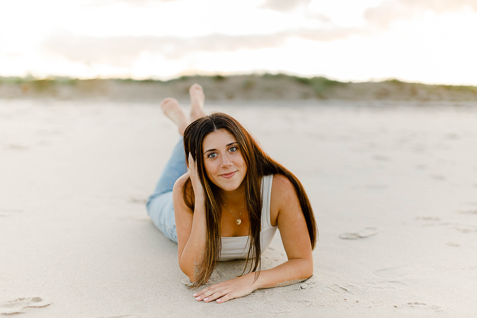 Photo by Scituate Senior Portrait Photographer Christina Runnals | High school girl laying on the beach
