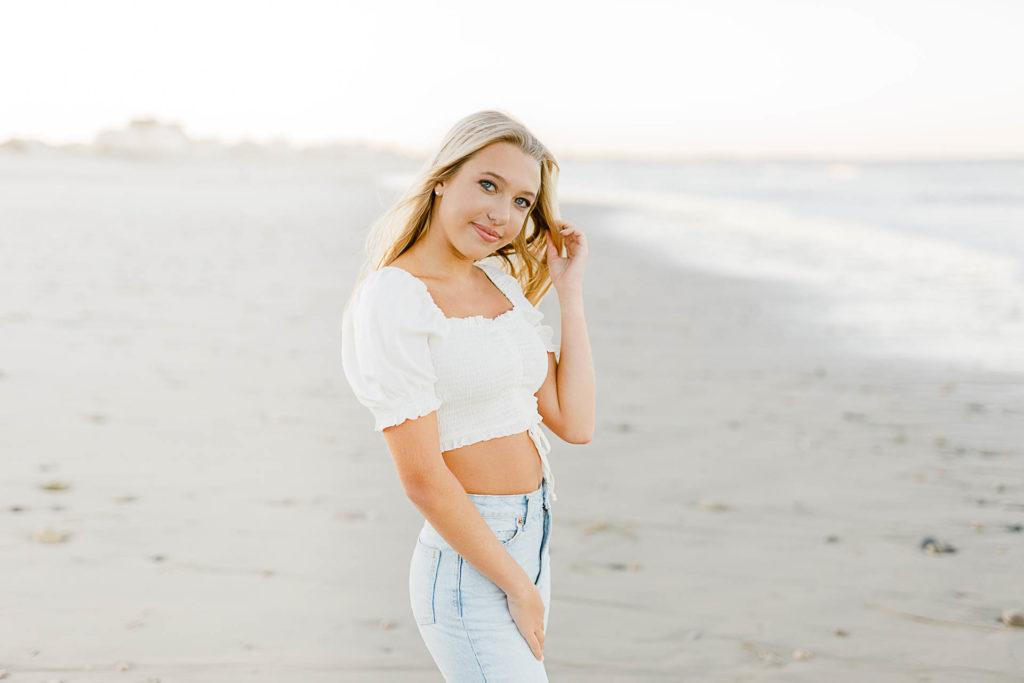 Photo by the best senior photographer in Massachusetts Christina Runnals | Girl standing on the beach