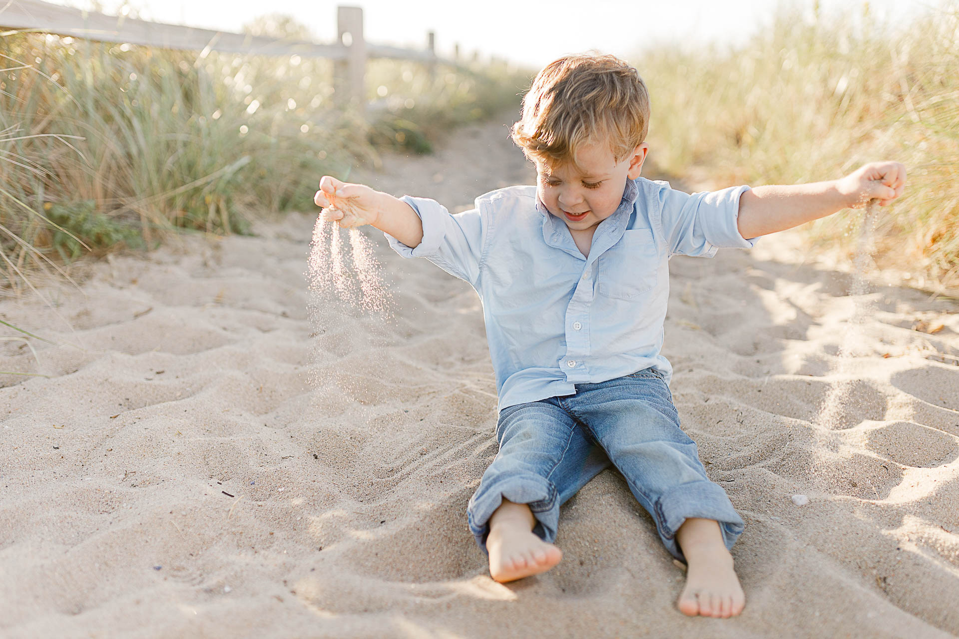 Watch Hill Family Portraits by Christina Runnals Photography | Boy playing with sand