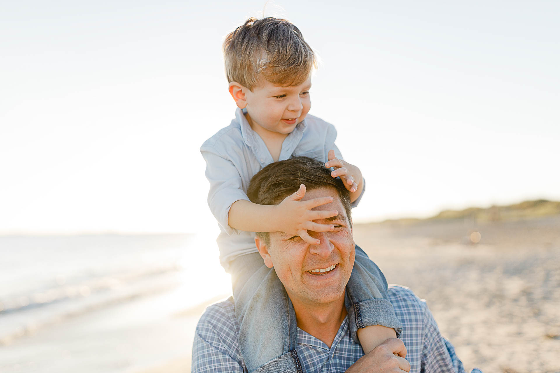 Watch Hill Family Portraits by Christina Runnals Photography | Dad and his son laughing