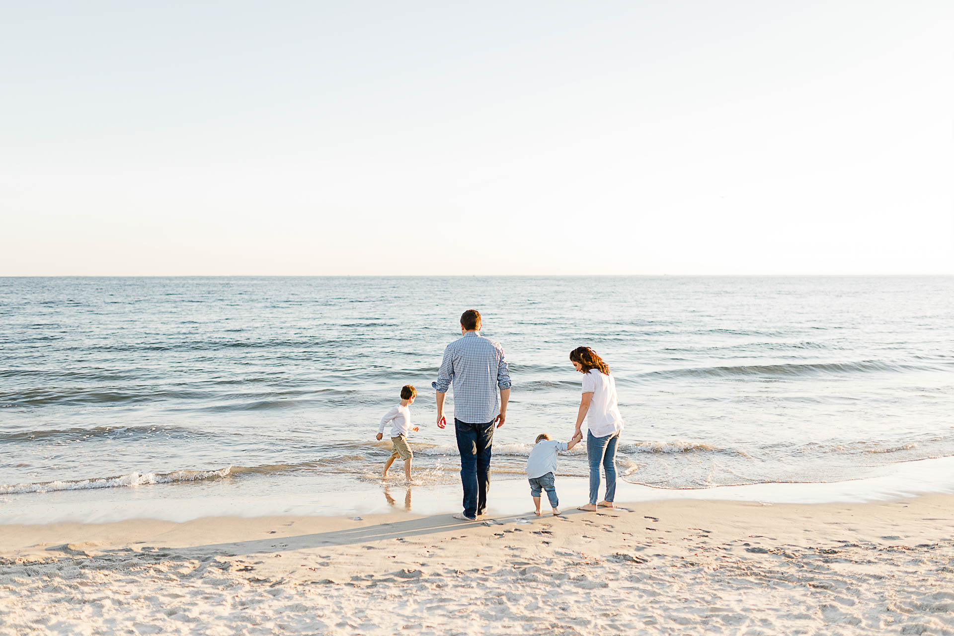 Watch Hill Family Portraits by Christina Runnals Photography | Family playing in the ocean