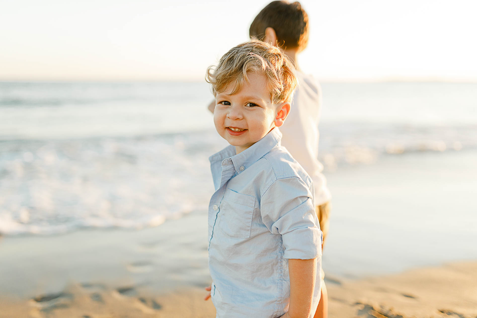 Watch Hill Family Portraits by Christina Runnals Photography | Little boy smiling on the beach