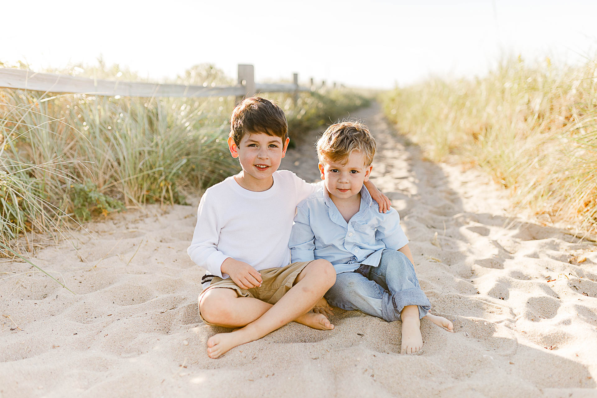 Watch Hill Family Portraits by Christina Runnals Photography | Brothers sitting in the sand
