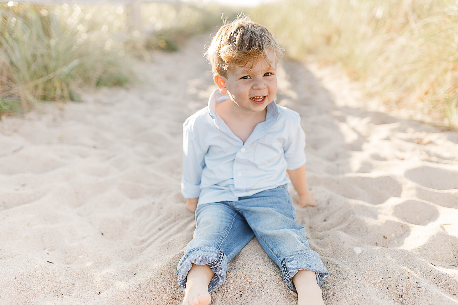 Watch Hill Family Portraits by Christina Runnals Photography | Boy sitting in the sand