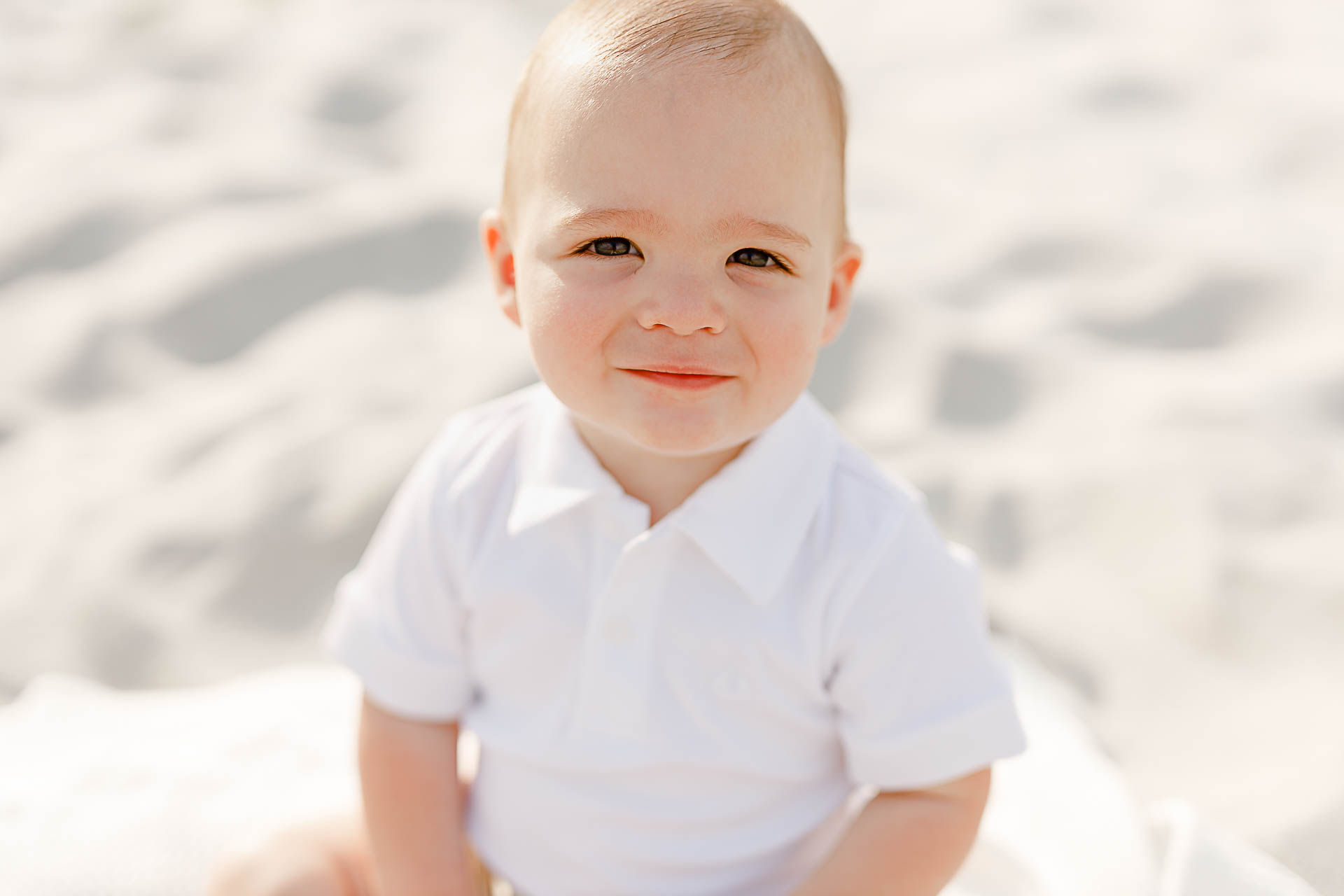 Image by South Shore Baby Photographer Christina Runnals | Baby sitting on the beach