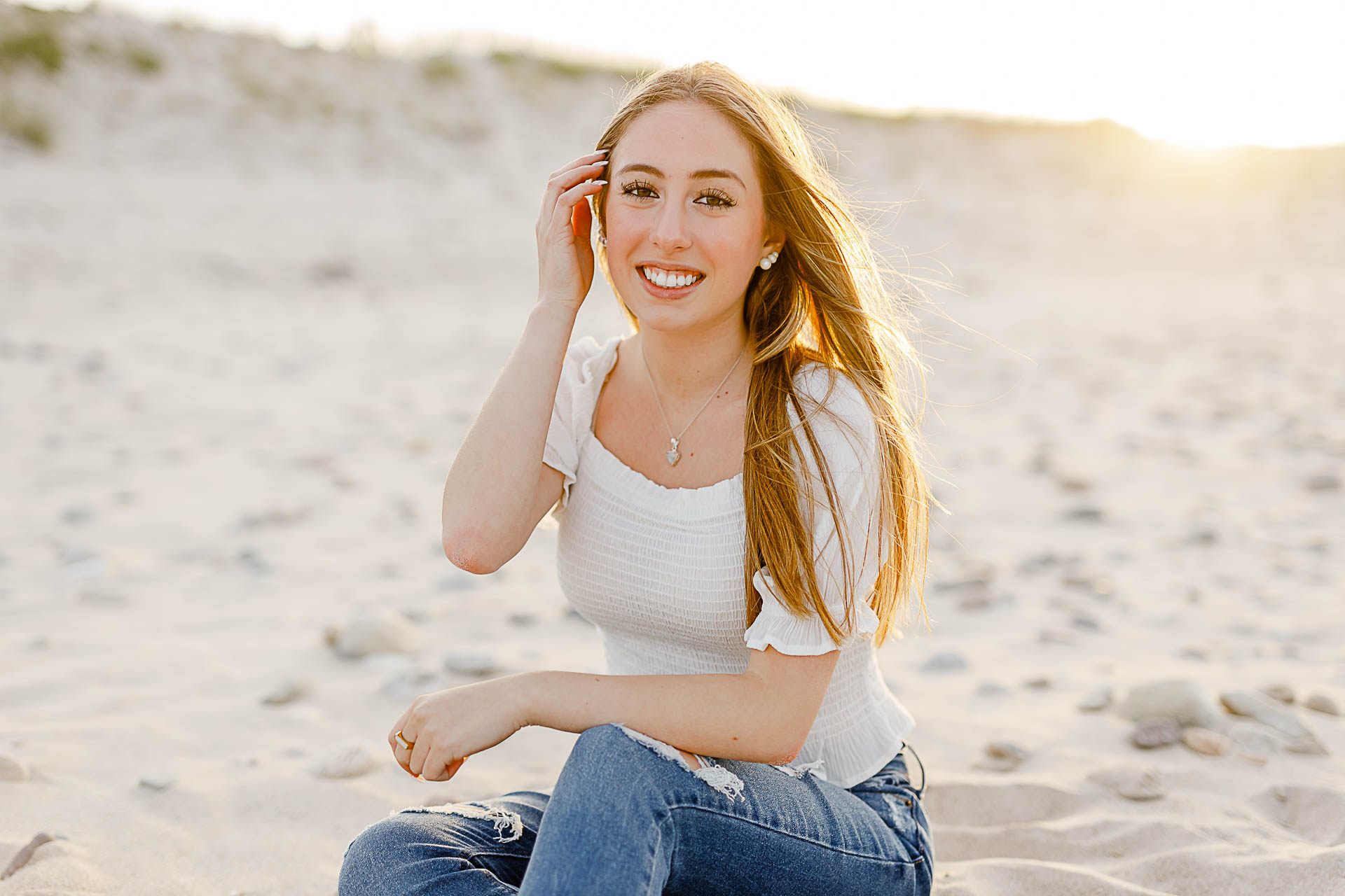 Photo by Arlington senior portrait photographer Christina Runnals | Girl sitting in the sand