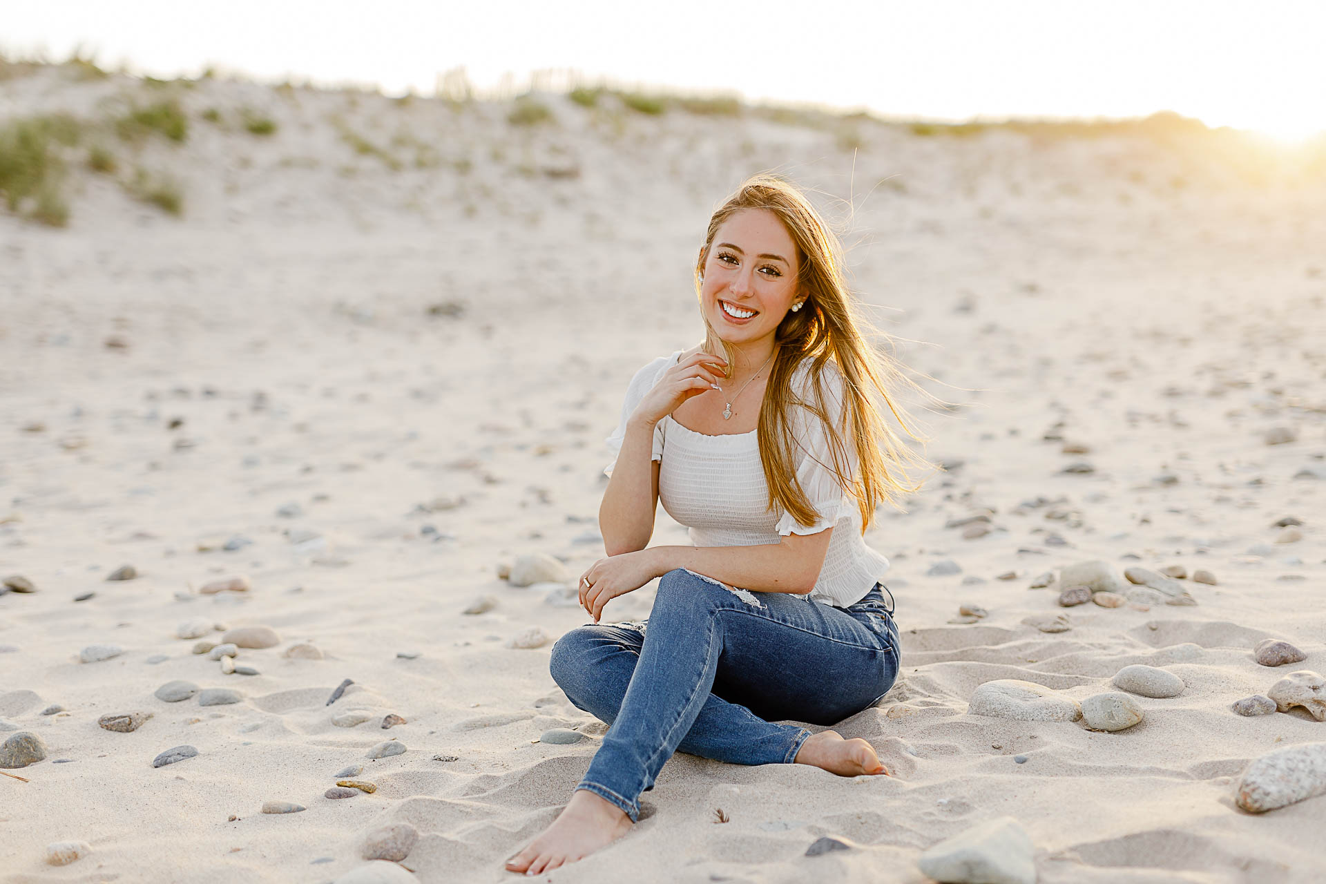 Photo by Scituate senior portrait photographer Christina Runnals | Girl sitting in the sand
