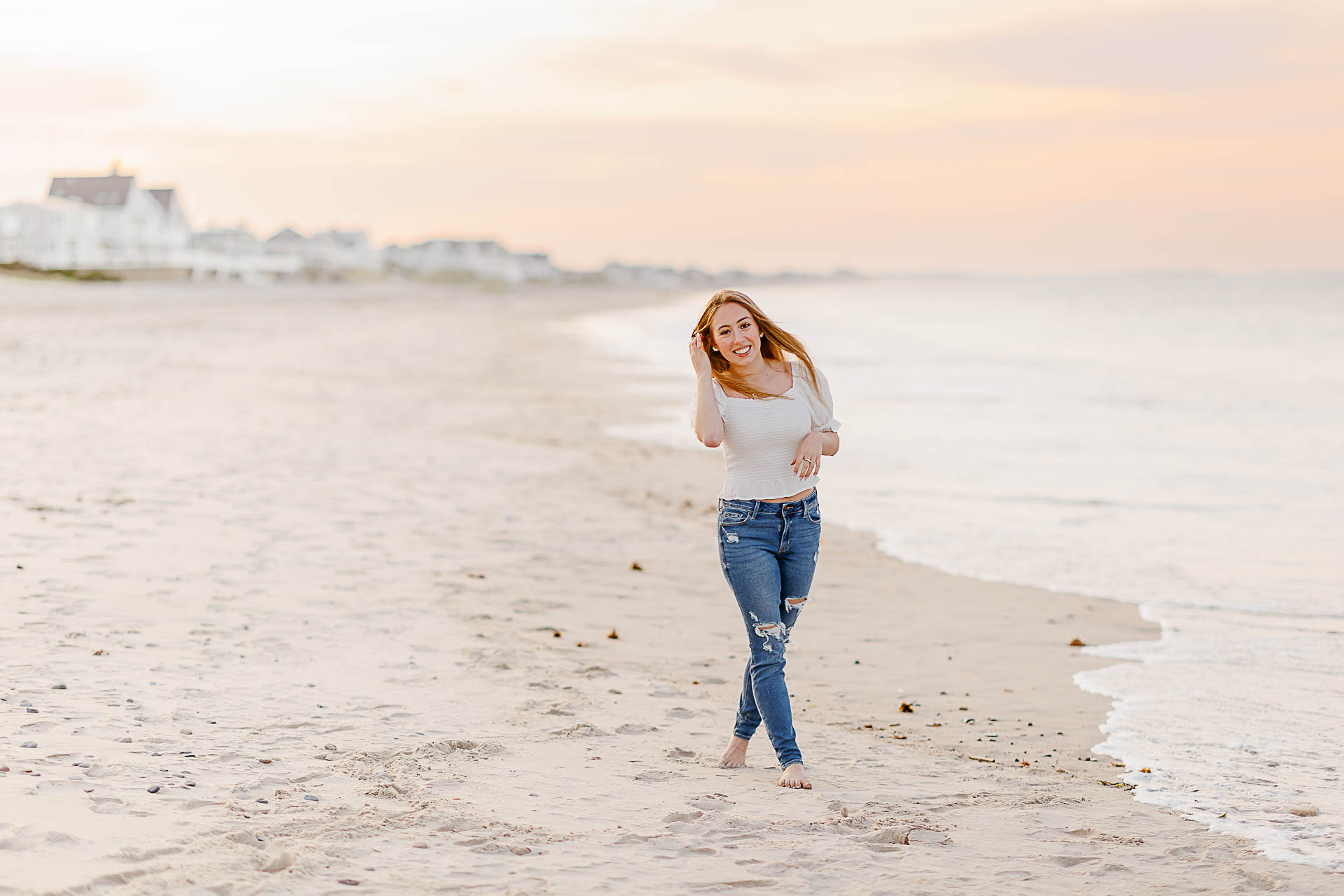 Photo by Arlington senior portrait photographer Christina Runnals | Girl walking on the beach