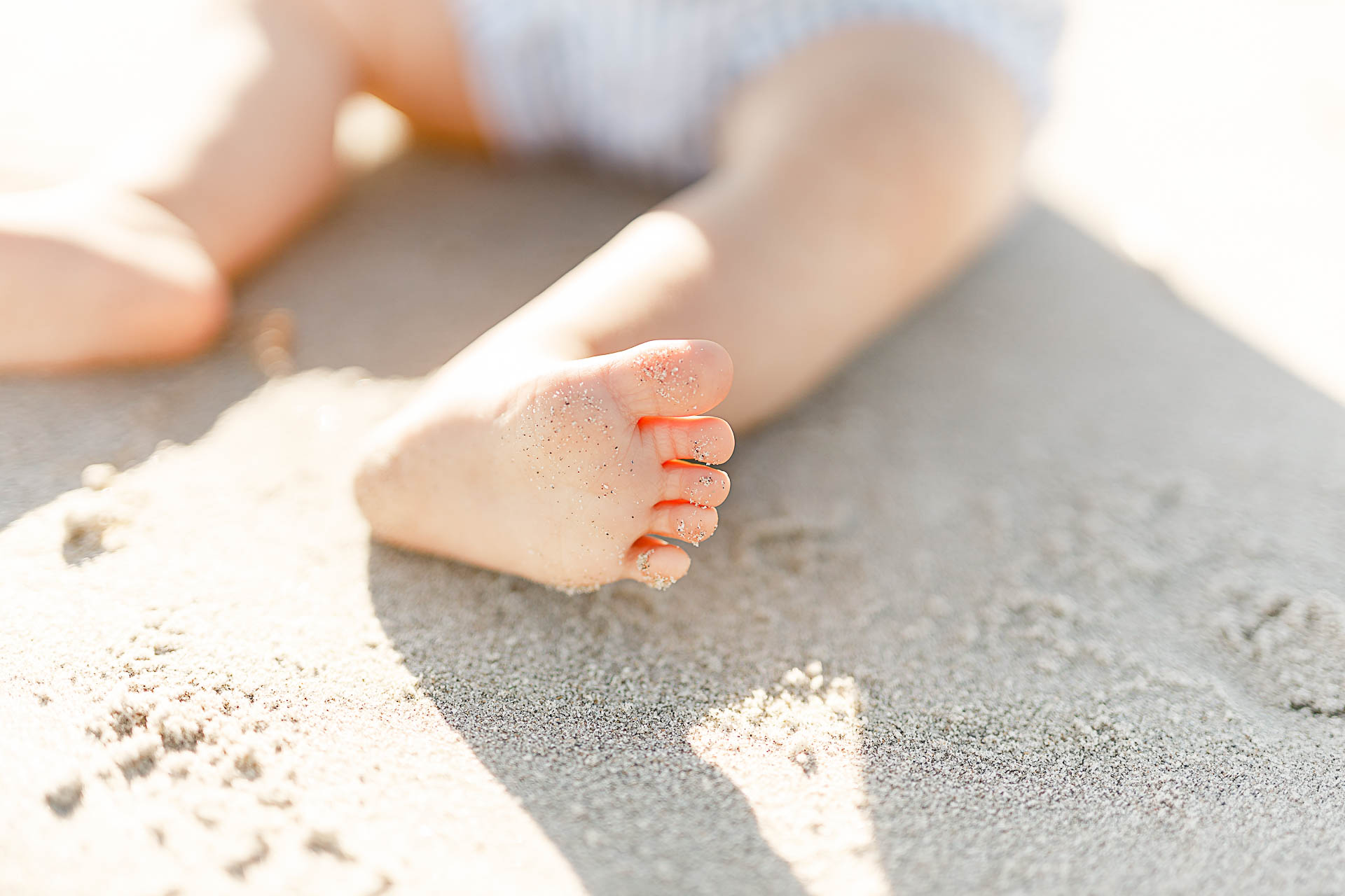 Photo by Boston baby photographer Christina Runnals | Sandy feet on the beach