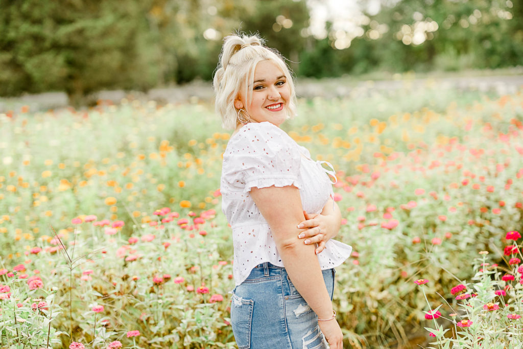 Teenage girl's senior pictures with flowers in Massachusetts