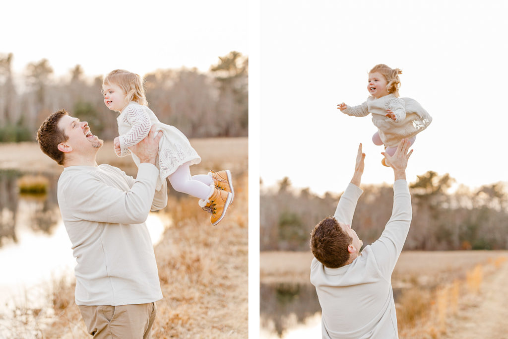Dad throwing little girl in the air