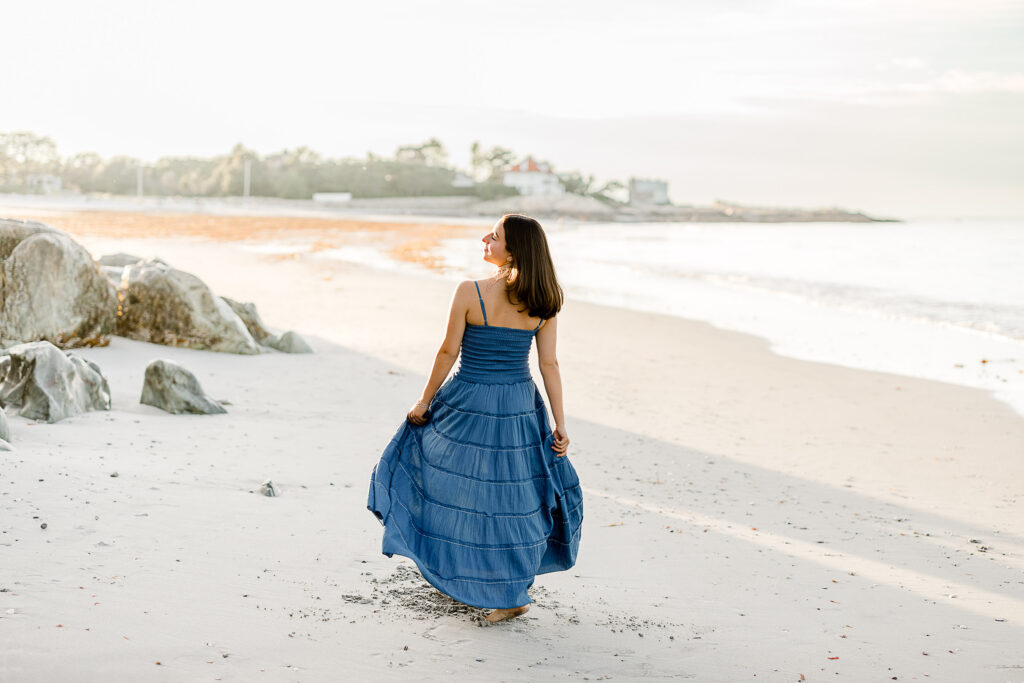 Abbie Young's blue dress senior pictures taken at a Massachusetts beach