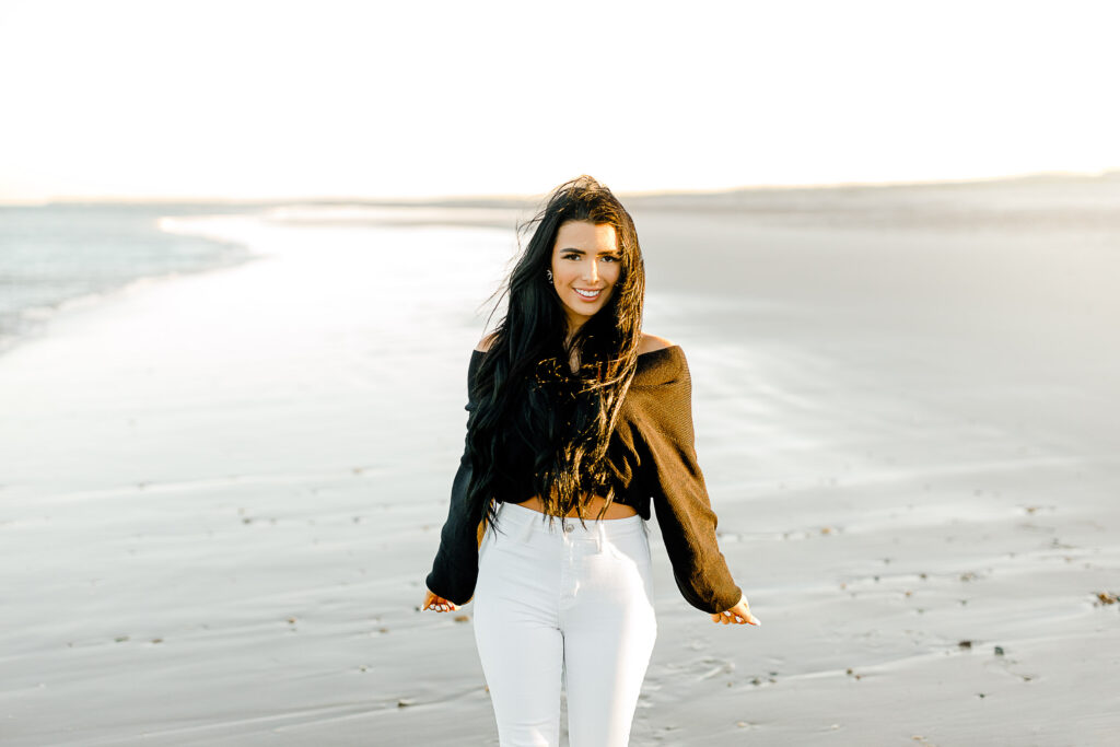 Image by best senior photographer in Massachusetts Christina Runnals | Girl walking in the sand on Duxbury Beach