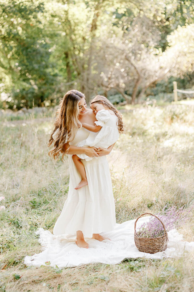Massachusetts Mother's Day Mini Sessions with Christina Runnals Photography in a beautiful green field with a basket of lavender