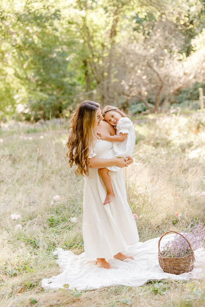 Massachusetts Mother's Day Mini Sessions with Christina Runnals Photography in a beautiful green field with a basket of lavender