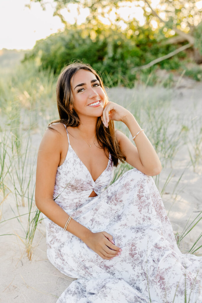 Beach senior portraits South Shore MA with a senior from New Hampshire wearing a long flowing floral dress