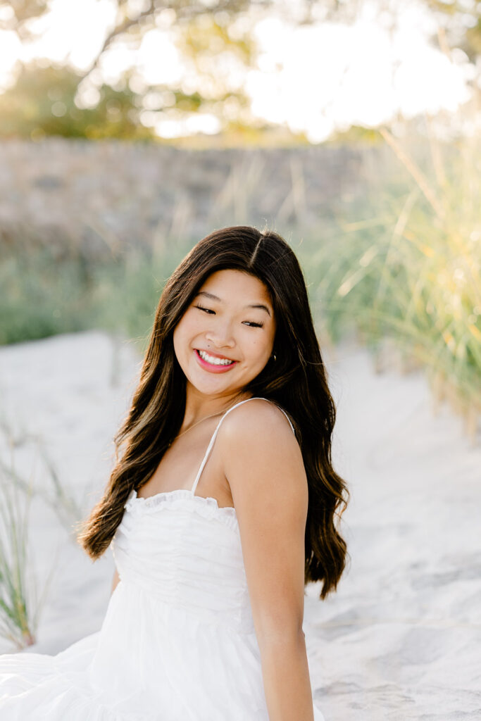 Senior portraits of a girl in a short white sundress by Hopkinton MA senior photographer Christina Runnals