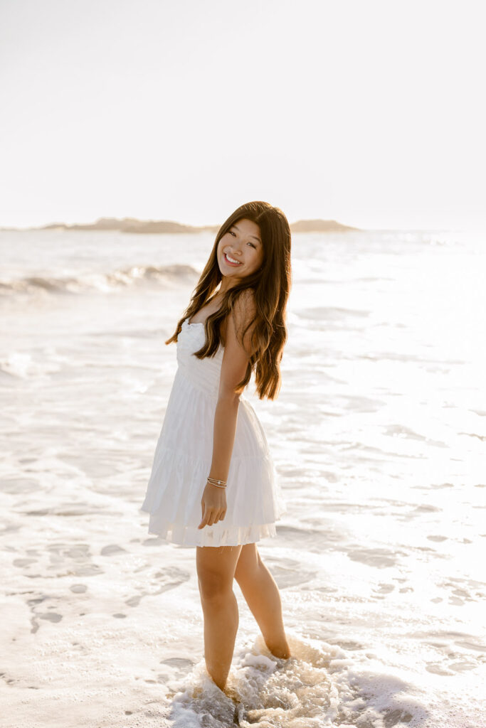 Senior portraits of a girl in a short white sundress by Hopkinton MA senior photographer Christina Runnals