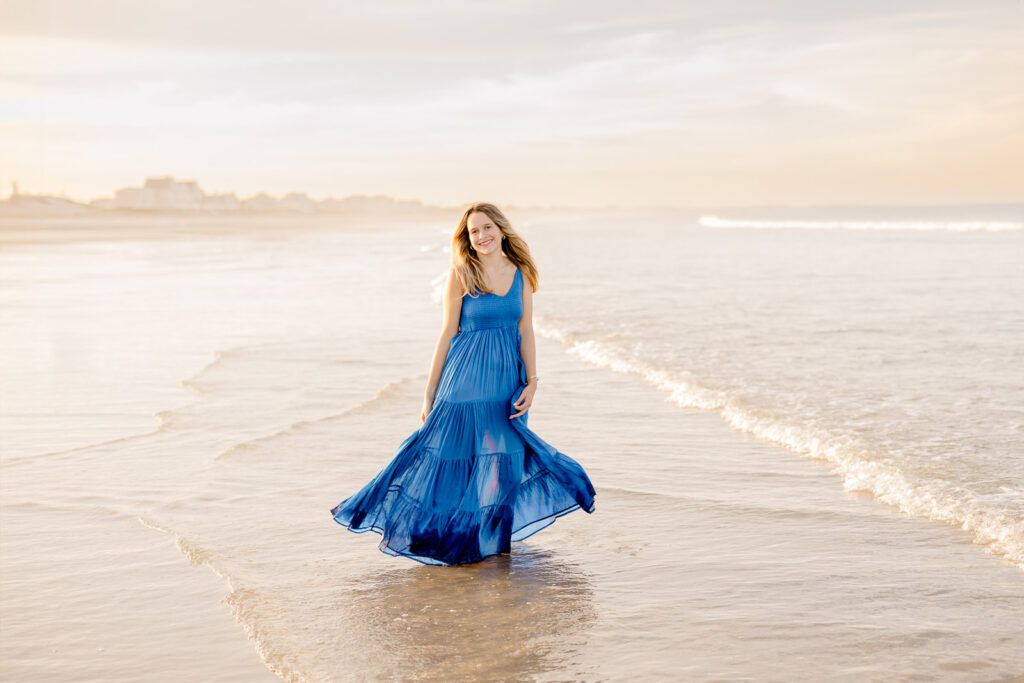 Senior portrait of a girl in a long blue dress by Stow MA senior photographer Christina Runnals