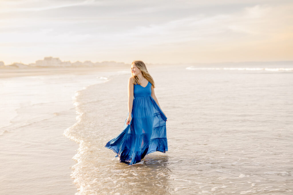 Senior portrait of a girl in a long blue dress by Stow MA senior photographer Christina Runnals