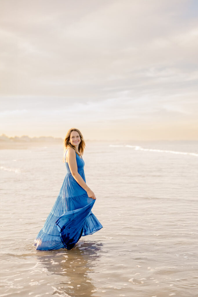 Senior portrait of a girl in a long blue dress by Stow MA senior photographer Christina Runnals